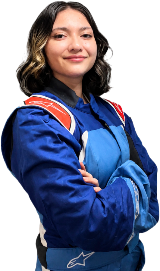 Nena in her blue race suit, arms folded